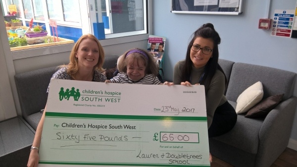 Lauren Graver hands over her donation from her fundraising Lauren Graver hands over her donation from her fundraising